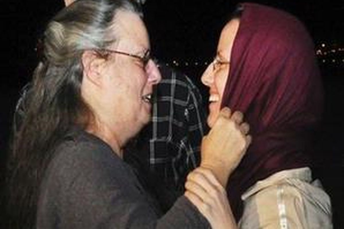 Sarah Shourd, 32, of the U.S., right, embraces her mother Nora Shourd, left, on Sarah Shourds arrival at the royal airport in Muscat, Oman, Tuesday, Sept. 14, 2010, after leaving Tehran, Iran. The American woman released by Iran on Tuesday after more than a year in prison said she was grateful to Irans president for her freedom shortly before she boarded a flight to the Gulf sultanate of Oman where her mother greeted her with a warm embrace  