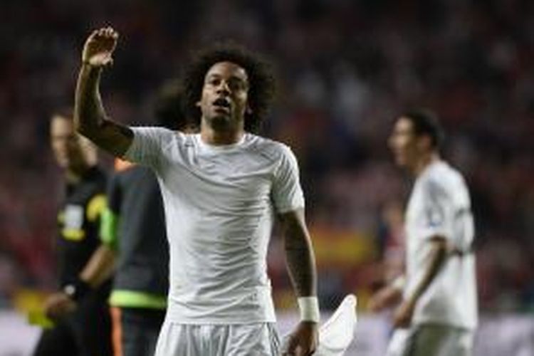 Bek Real Madrid, Marcelo, merayakan golnya ke gawang Atletico Madrid, pada menit ke-90 3 final Liga Champions, di Estadio da Luz, Lisabon, Sabtu (24/5/2014).