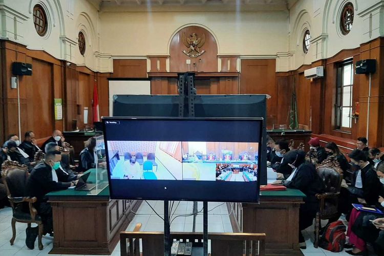 The first trial for negligence over the deadly football stampede is held online from an Indonesian court in Surabaya, East Java, Monday, January 16, 2023 due to security concerns. 