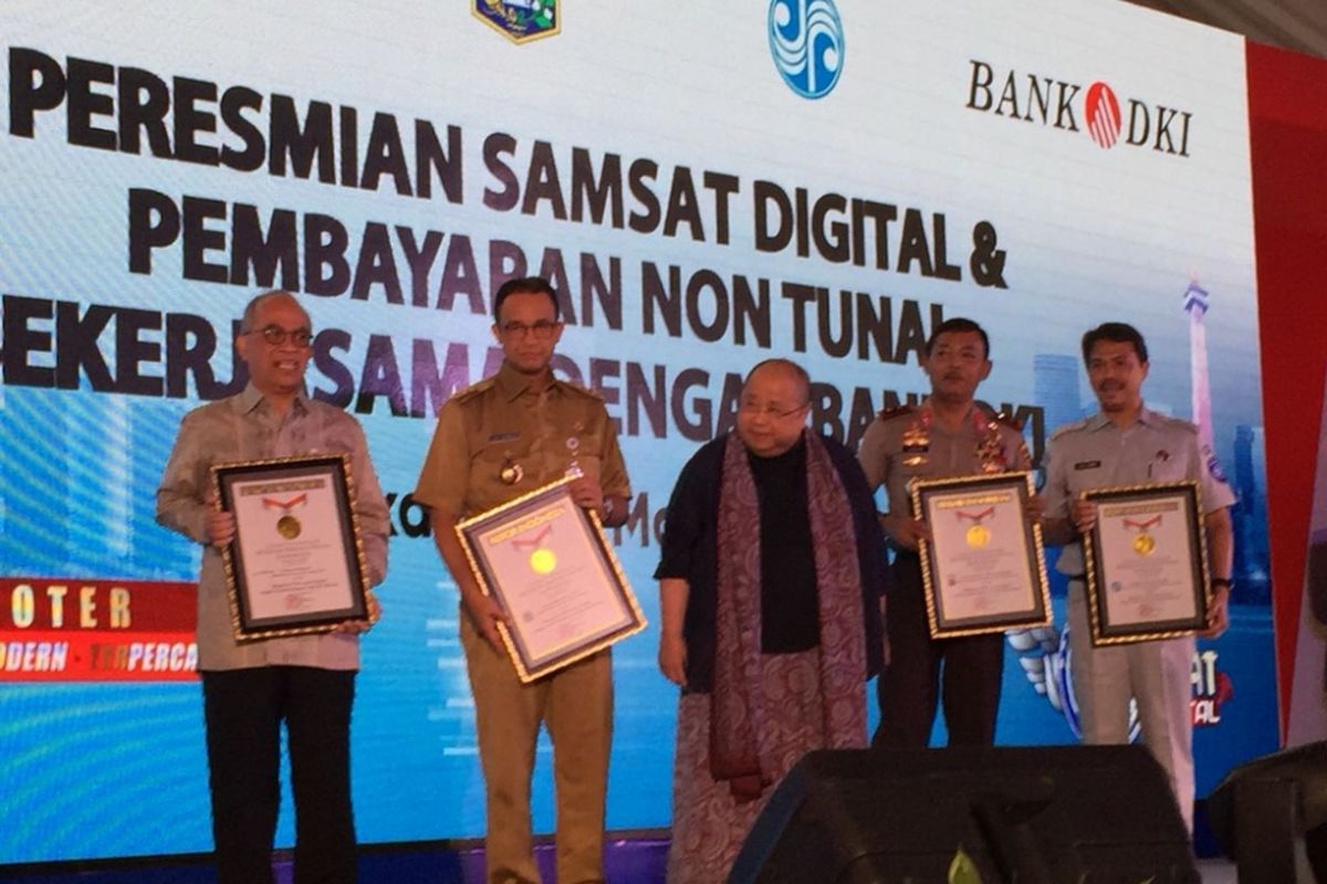 Polda Metro Jaya dan Pemerintah Provinsi (Pemprov) DKI Jakarta meluncurkan sistem pembayaran pajak dan balik nama  kendaran bermotor melalui sistem cash less atau non tunai, Senin (26/3/2018).