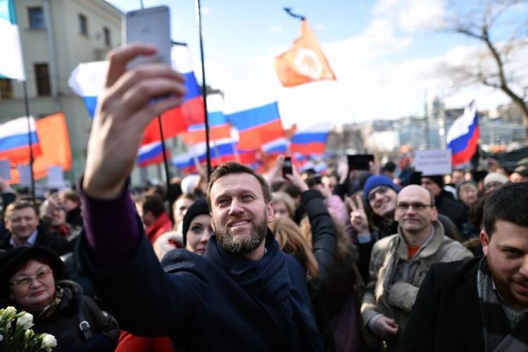 Pemimpin kubu oposisi Rusia Alexei Navalny dalam sebuah aksi di Rusia.  