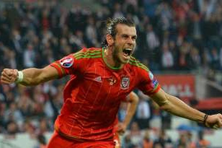 Gareth Bale merayakan gol Wales ke gawang Belgia pada partai kualifikasi Piala Eropa 2016 di Cardiff City Stadium, 12 Juni 2015.