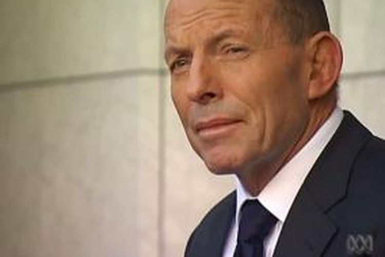 Tony Abbott tampak murung saat memberikan keterangan pers terakhir sebagai perdana menteri Australia, Selasa (15/9/2015).