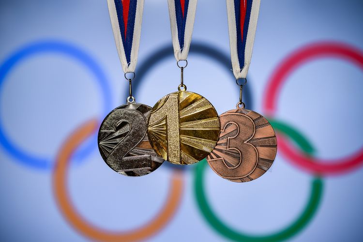 Ilustrasi logo dan medali-medali olimpiade.