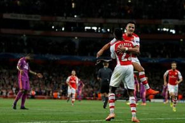 Striker Arsenal, Danny Welbeck, saat merayakan golnya ke gawang Galatasaray pada matchday kedua Grup D Liga Champions di Stadion Emirates, Rabu (1/10/2014). Arsenal menang 4-1 pada pertandingan tersebut. 