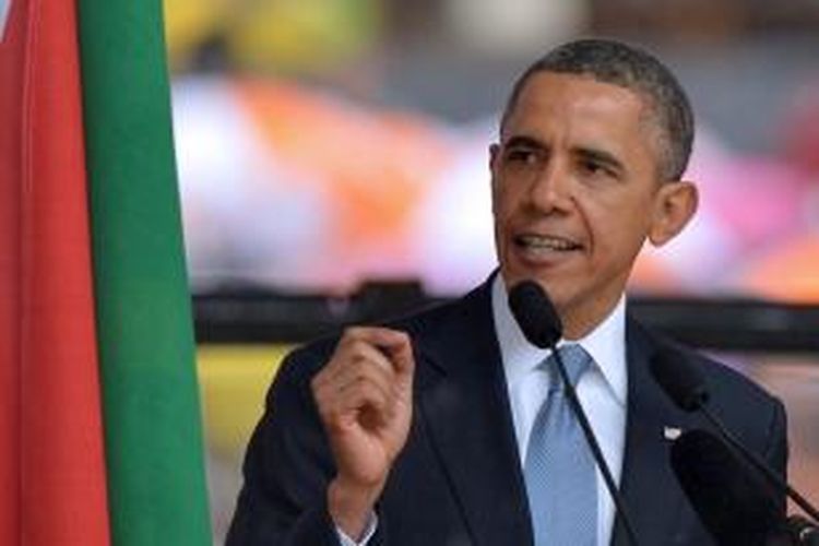 Presiden AS Barack Obama berpidato dalam acara mengenang Nelson Mandela di Soweto, Afrika Selatan, Selasa (10/12/2013).