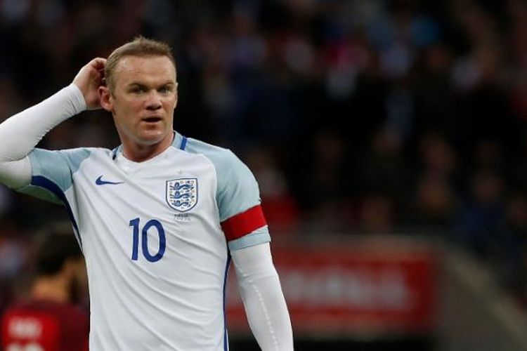 Reaksi striker Inggris, Wayne Rooney, saat melakoni uji coba kontra Portugal di Stadion Wembley, 2 Juni 2016.