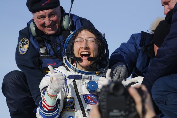NASA astronaut Christina Koch reacts shortly after landing in a remote area outside the town of Dzhezkazgan (Zhezkazgan), Kazakhstan, on February 6, 2020. - NASAs Christina Koch returned to Earth safely Thursday having shattered the spaceflight record for female astronauts after almost a year aboard the International Space Station. Koch touched down at 0912 GMT on the Kazakh steppe after 328 days in space along with Luca Parmitano of the European Space Agency and Alexander Skvortsov of the Russian space agency. (Photo by Sergei ILNITSKY / POOL / AFP)
