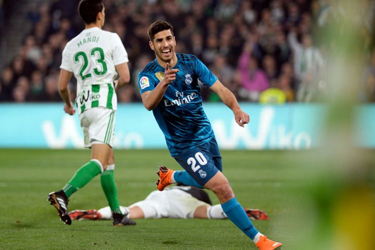 Marco Asensio merayakan gol Real Madrid ke gawang Real Betis pada pertandingan La Liga di Stadion Benito Villamarin, Minggu (18/2/2018).