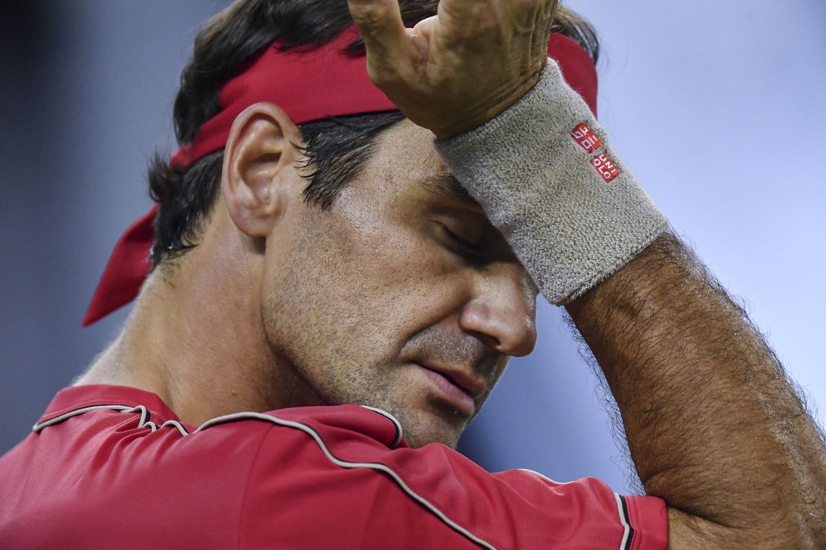 Roger Federer of Switzerland gestures while playing against Alexander Zverev of Germany during their mens singles quarter-final match at the Shanghai Masters tennis tournament in Shanghai on October 11, 2019. (Photo by HECTOR RETAMAL / AFP)