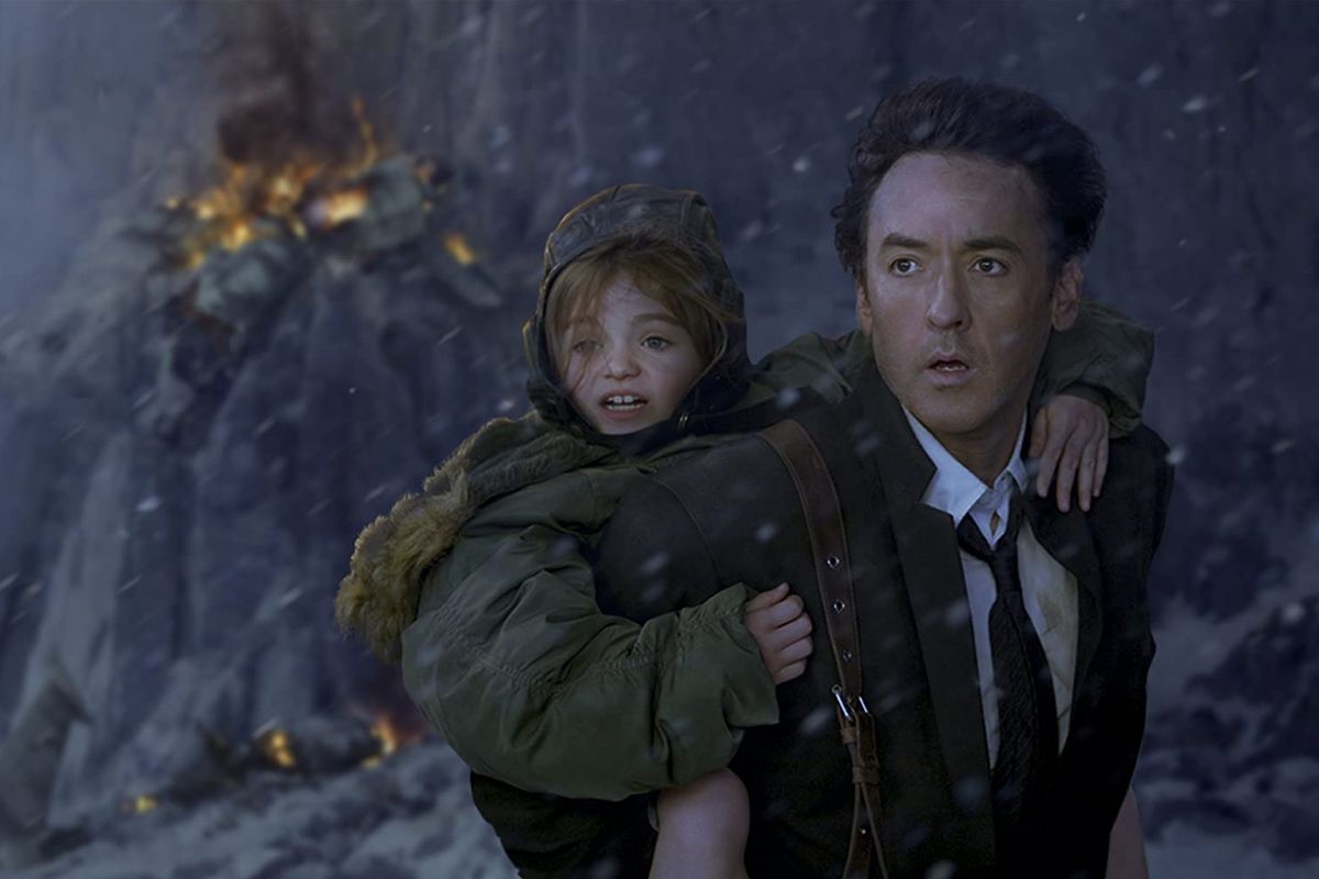 Aksi John Cusack dan Morgan Lily dalam film 2012