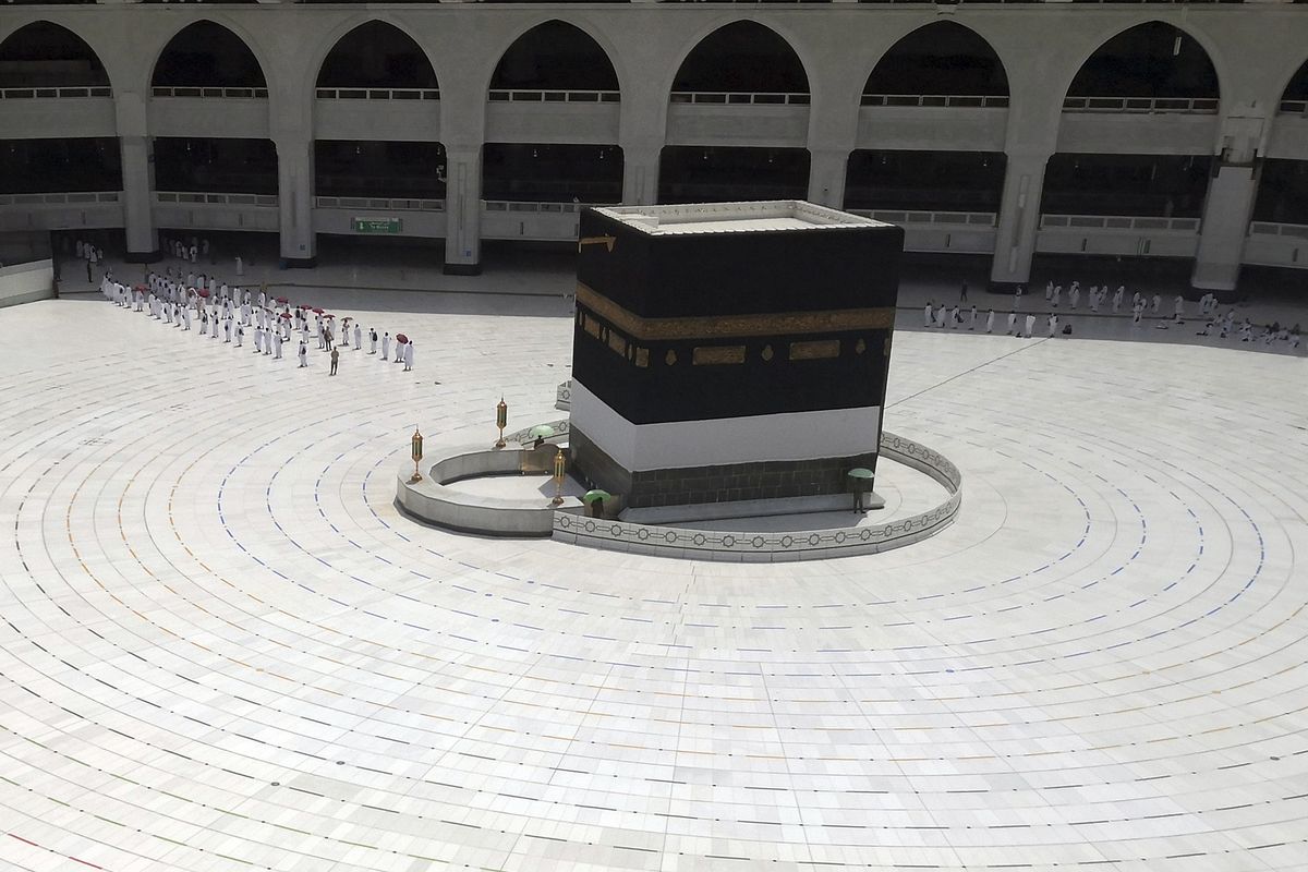 Muslim pilgrims line up as they leave after they circle the Kaaba, the cubic building at the Grand Mosque, as they keep social destination to protect themselves against Coronavirus a ahead of the Hajj pilgrimage in the Muslim holy city of Mecca, Saudi Arabia, Wednesday, July 29, 2020. During the first rites of hajj, Muslims circle the Kaaba counter-clockwise seven times while reciting supplications to God, then walk between two hills where Ibrahims wife, Hagar, is believed to have run as she searched for water for her dying son before God brought forth a well that runs to this day. (AP Photo)