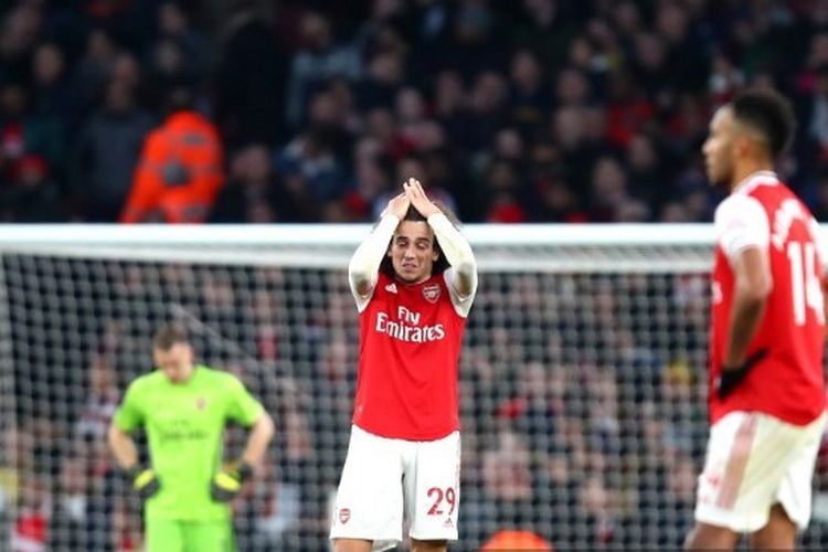 Ekspresi pemain Arsenal, Matteo Guendouzi dab Pierre-Emerick Aubameyang pada laga Arsenal vs Chelsea dalam lanjutan pekan ke-20 Liga Inggris 2019-2020.