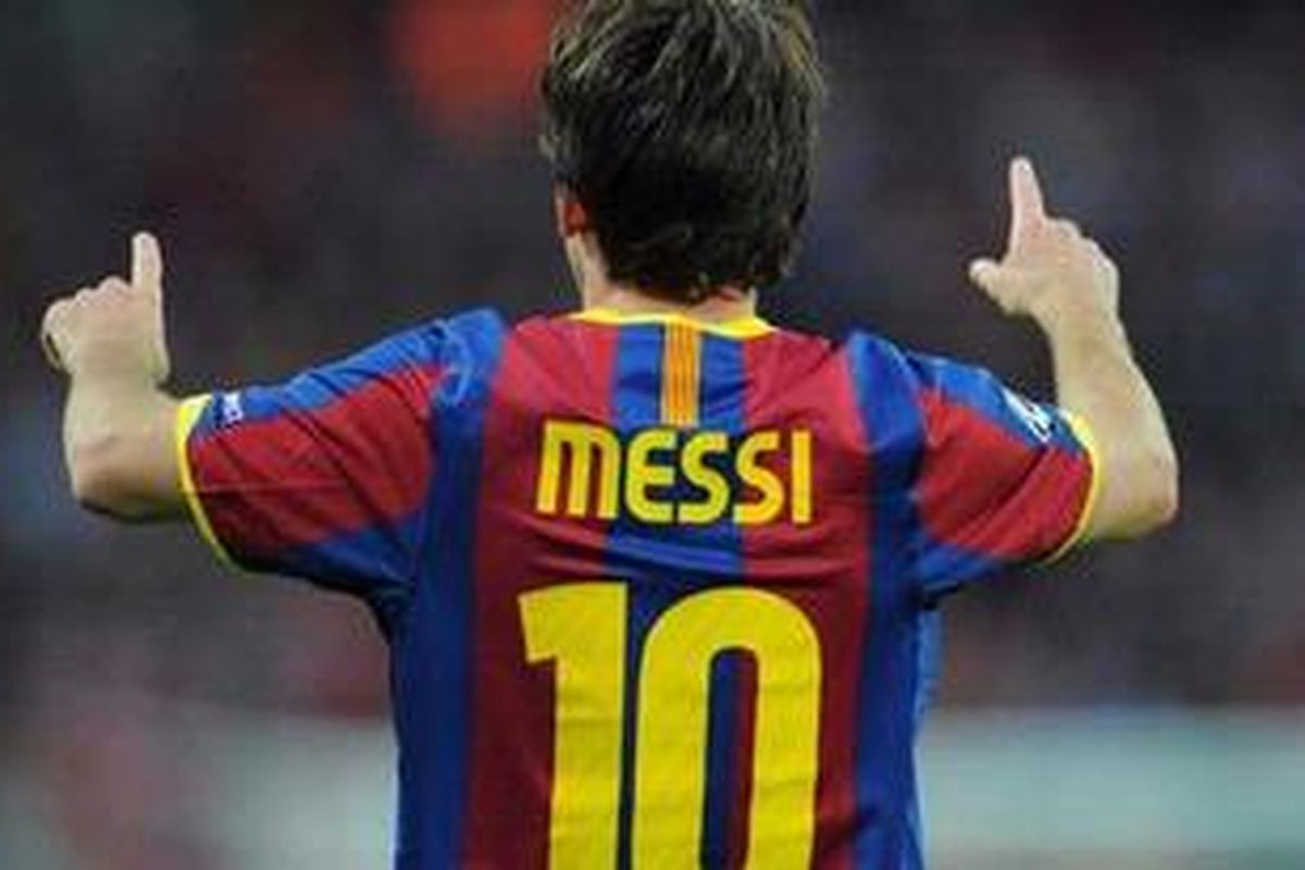 Penyerang Barcelona, Lionel Messi, merayakan golnya ke gawang Manchester United, di final Liga Champions, di Stadion Wembley, Sabtu (28/5/2011).