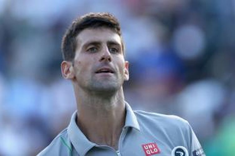 Petenis Serbia Novak Djokovic bereaksi setelah meraih kemenangan atas Andy Murray dari Inggris pada perempat final Sony Open di Crandon Park Tennis Center, Rabu (26/3/2014). Djokovic menang 7-5, 6-3.