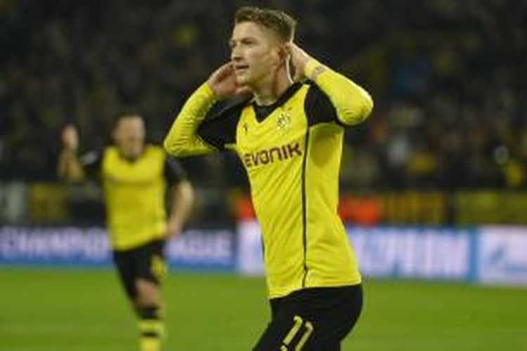 Gelandang Borussia Dortmund Marco Reus merayakan salah satu dari dua golnya ke gawang Real Madrid, pada leg kedua perempat final Liga Champions, di Signal Iduna Park, Selasa (8/4/2014).