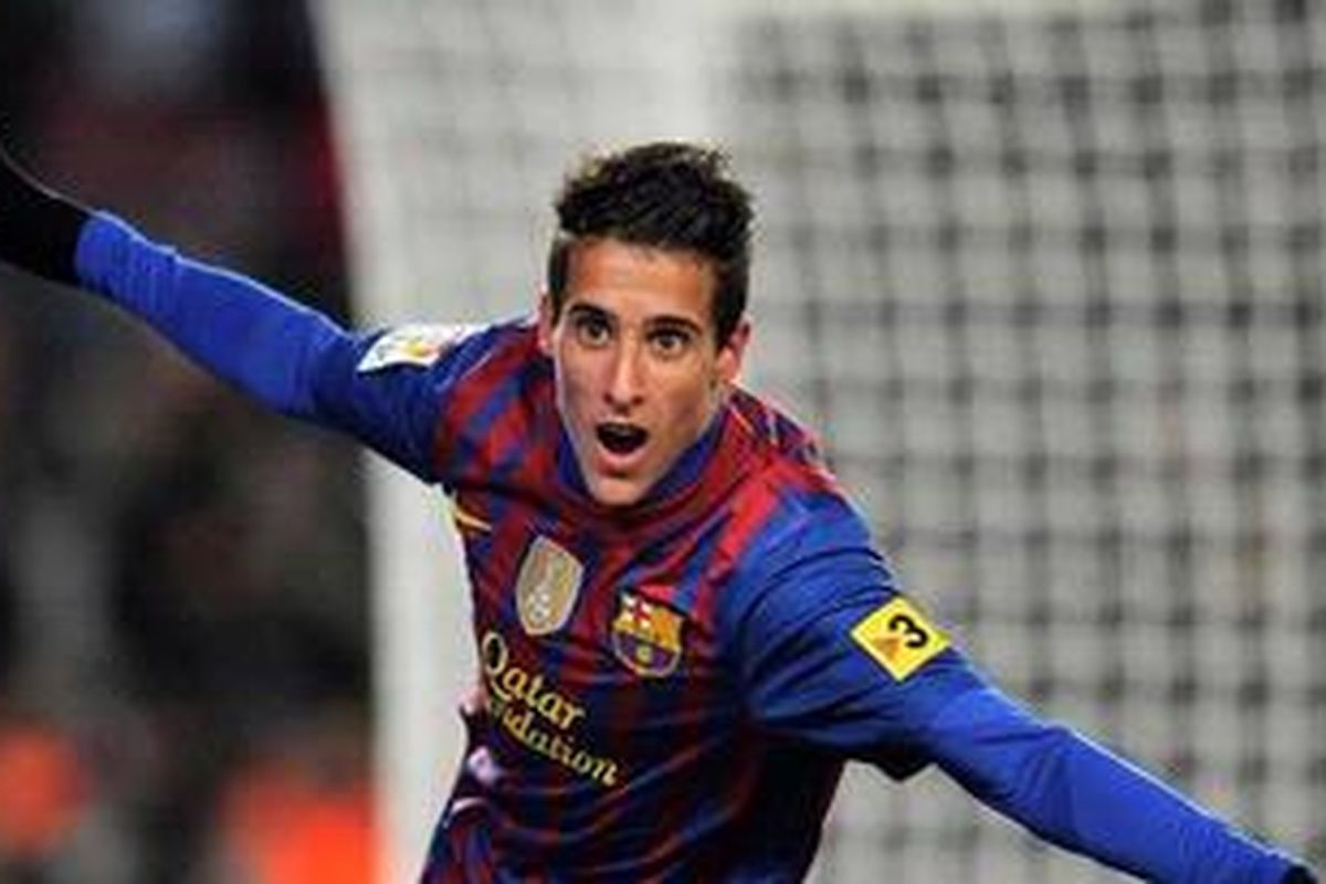 Penyerang Barcelona, Cristian Tello, merayakan golnya ke gawang Real Sociedad, pada laga Liga BBVA, di Camp Nou, Sabtu (4/2/2012).