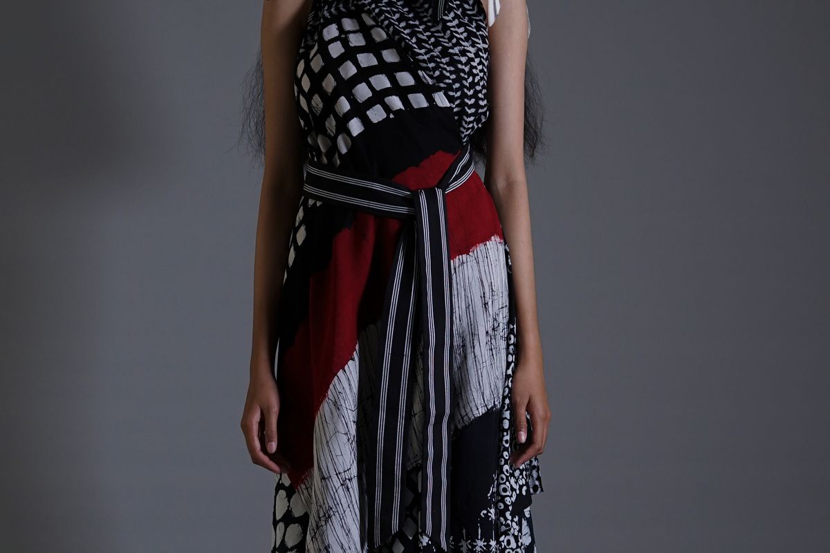 A model wearing lurik, Indonesian traditional weaving fabric, by fashion designer Lulu Lutfi Labibi.                               