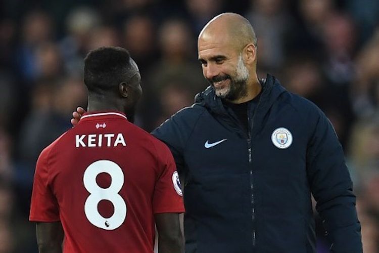 Pep Guardiola tampak berbincang dengan Naby Keita seusai laga Liverpool vs Manchester City di Stadion Anfield, 7 Oktober 2018. 