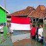 Di Tanah Merdeka, Warga Timbulsloko Demak Upacara Bendera dalam Kepungan Banjir Rob