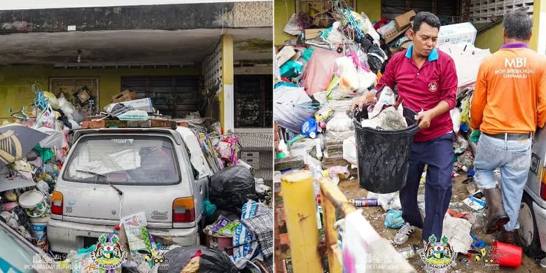 Operasi pembersihan timbunan sampah di rumah wanita lansia berusia 60-an tahun di Jalan Merpati, Taman Ipoh, negara bagian Perak, Malaysia, Senin (25/9/2023).