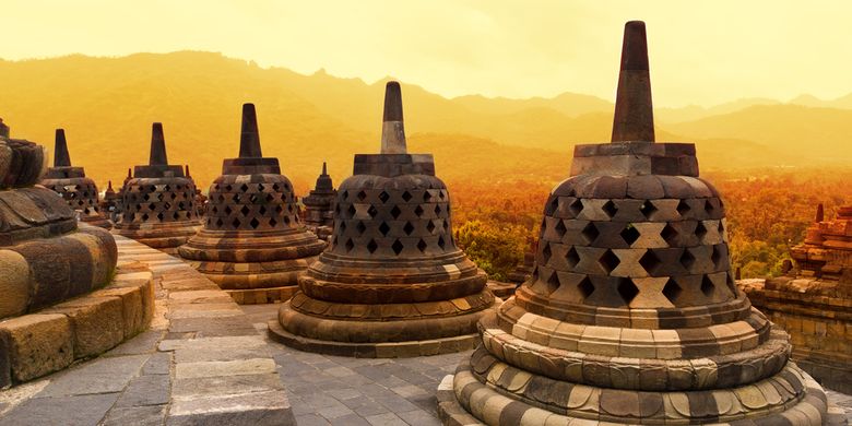 A section of the 7th-century Mahayana Buddhist temple known as Borobudur Temple in Magelang regency, Central Java, Indonesia during sunset. 