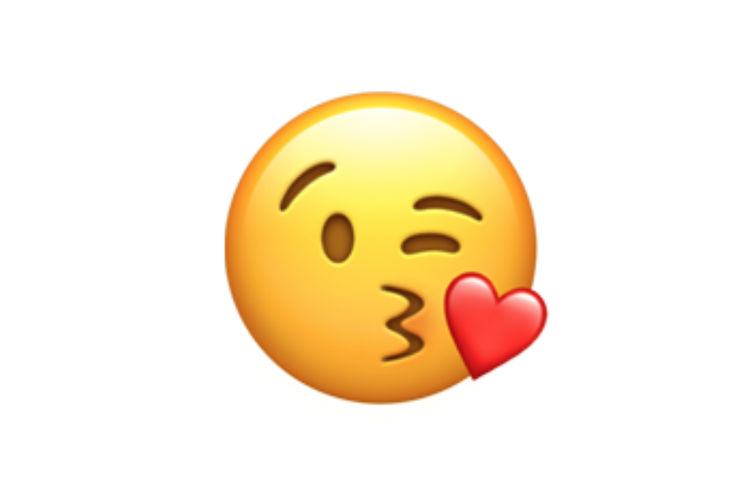 Ilustrasi emoji wajah mencium dengan hati.