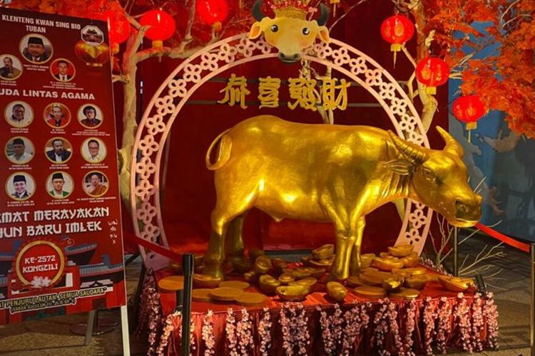 A golden-colored statue of an ox at the Kwan Sing Bio temple in Tuban, East Java