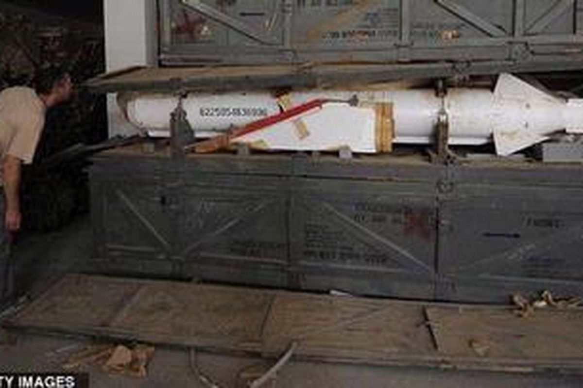 Under examination: One of Gaddafis deadly missiles that was hidden in one of 80 ammunition bunkers just south of Sirte  