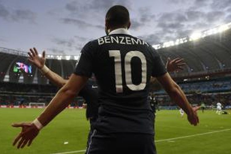 Striker Perancis, Karim Benzema, saat merayakan gol ke gawang Honduras pada pertandingan Grup E Piala Dunia 2014 di Stadion Beira-Rio, Minggu atau Senin (16/6/2014) dini hari WIB. Perancis menang 3-0 pada laga tersebut. 