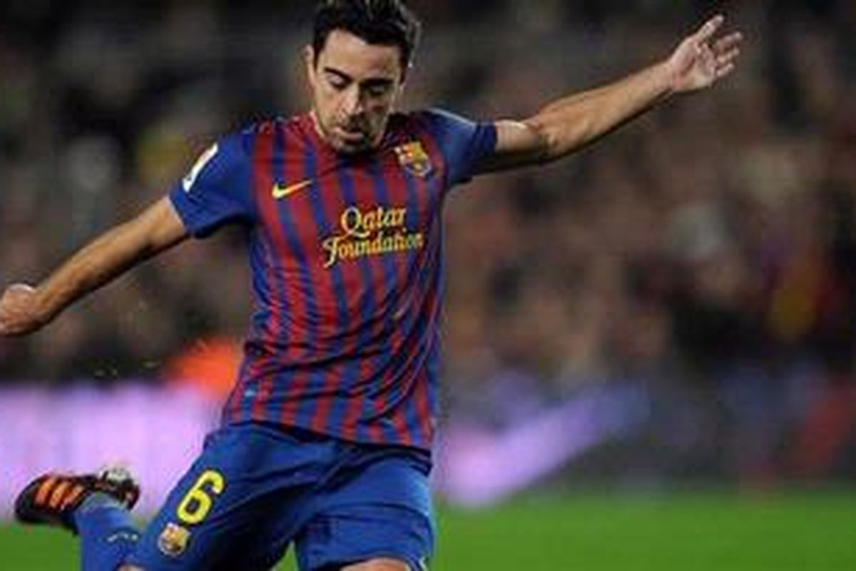 Salah satu aksi gelandang Barcelona, Xavi Hernandez, pada pertandingan 16 besar Copa del Rey, melawan Osasuna, di Camp Nou, Rabu (4/1/2012).