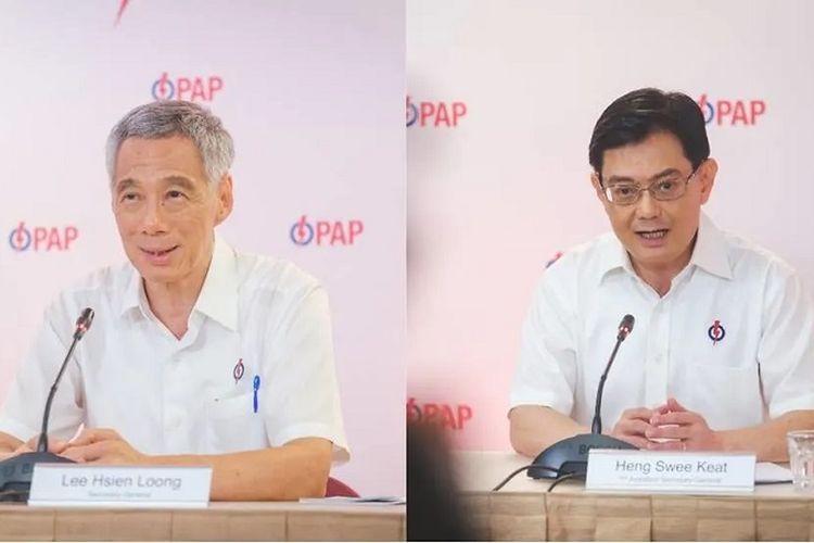 Perdana Menteri Singapura Lee Hsien Loong (kiri) dan calon penggantinya Deputi Perdana Menteri yang memutuskan mengundurkan diri Heng Swee Keat  