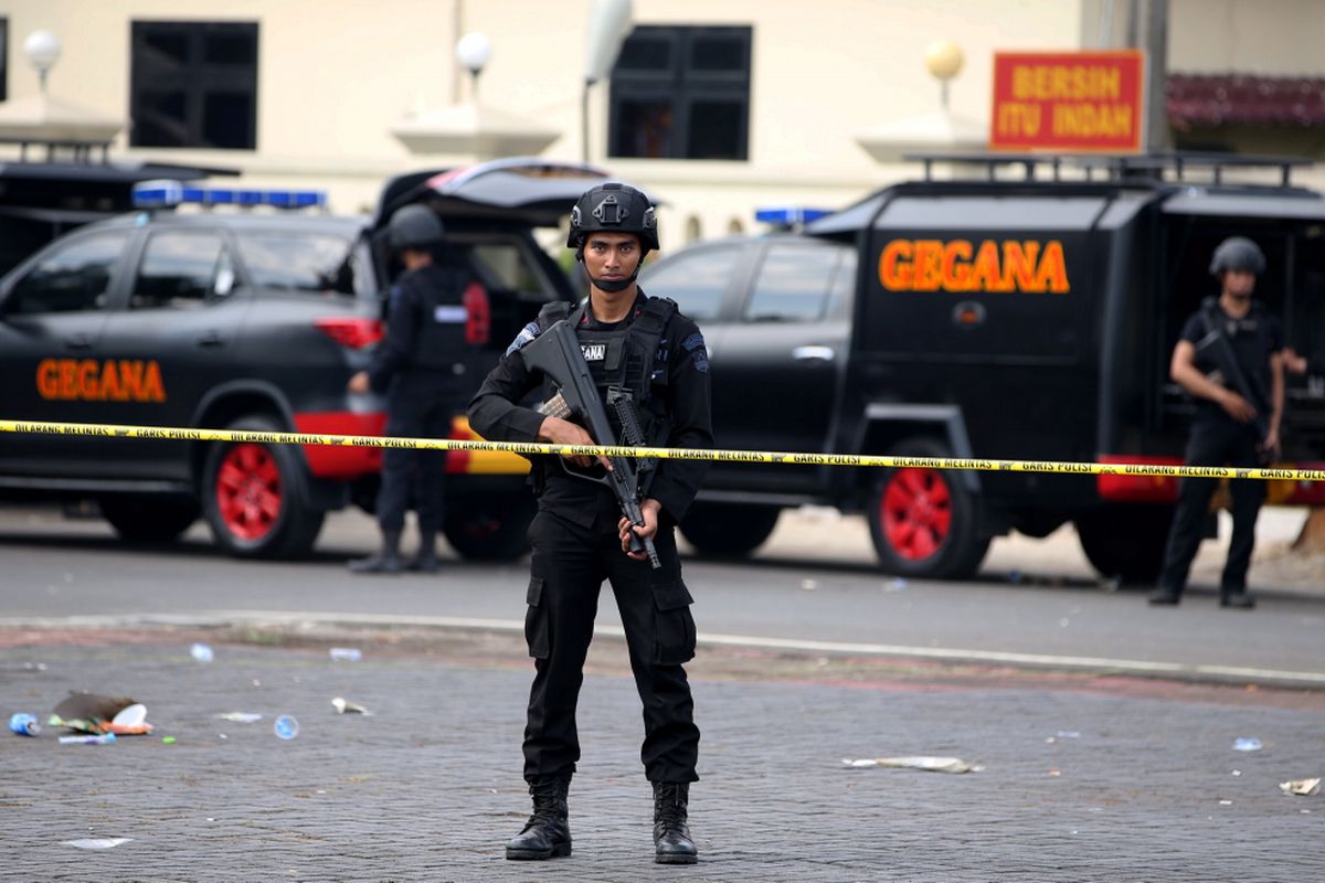 The Indonesian Police stand guard after the riot between convicted terrorists and police personnel at the Mobile Brigade headquarters on the outskirts of the capital Jakarta on Wednesday, May 5, 2018.