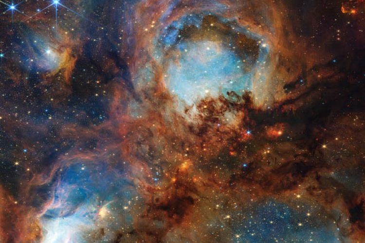 Citra Webb ini menunjukkan Nebula Telapak Kucing, wilayah pembentuk bintang masif yang terletak 5.500 tahun cahaya jauhnya di rasi bintang Scorpius. 