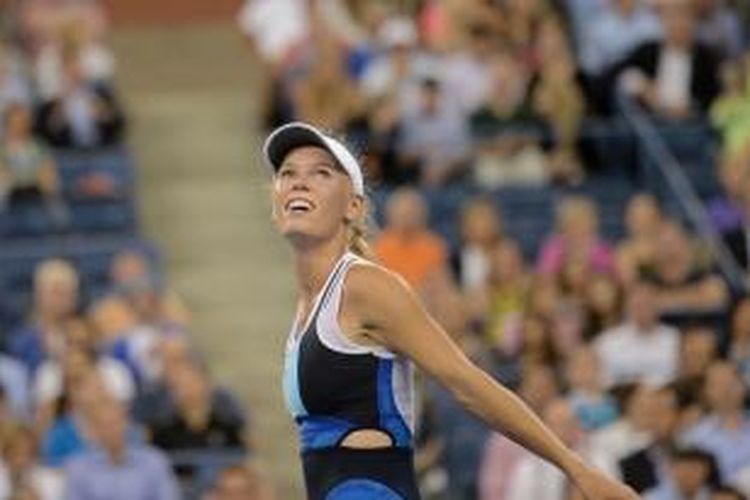 Petenis Denmark, Caroline Wozniacki, merayakan kemenangannya atas Chanelle Scheepers dari Afrika Selatan, pada babak kedua US Open, Kamis (29/8/2013).