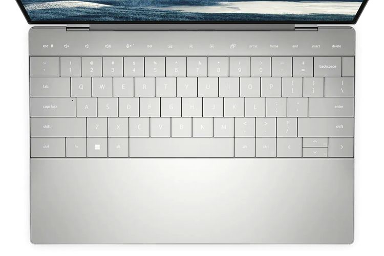 Ilustrasi papan utama laptop yang memuat keyboard dan tombol fungsi capacitive touch di Dell XPS 13 Plus.