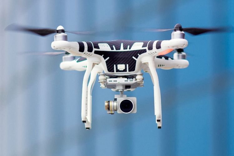 Ilustrasi drone yang dilengkapi kamera untuk merekam atau mengambil gambar.