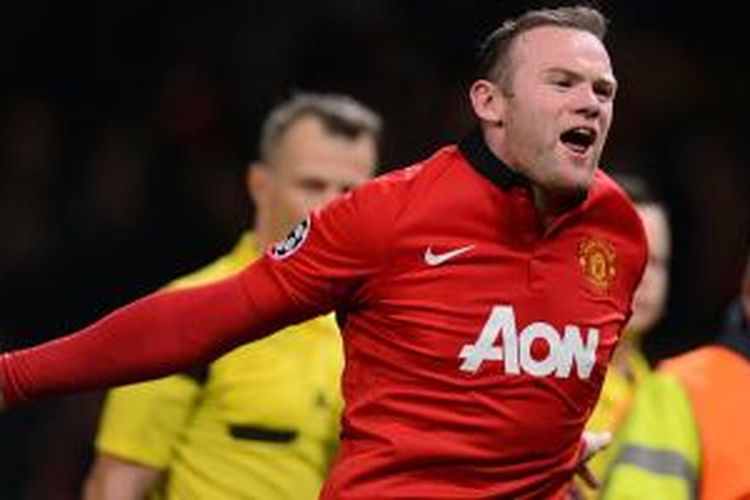 Striker Manchester United, Wayne Rooney, meluapkan kegembiraannya setelah mereka memastikan diri lolos ke perempat final Liga Champions usai menang 3-0 atas Olympiakos di leg kedua babak 16 besar, Rabu (19/3/2014), di Old Trafford. MU lolos dengan agregat 3-2.