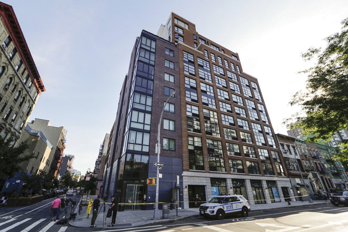 A New York Police cruiser is parked at 265 East Houston Street Wednesday, July 15, 2020, in New York. Police say the dismembered body of a 33-year-old tech entrepreneur has been found inside his luxury Manhattan condo. Fahim Saleh was found at around 3:30 p.m. Tuesday inside his apartment on the Lower East Side. (AP Photo/Frank Franklin II)