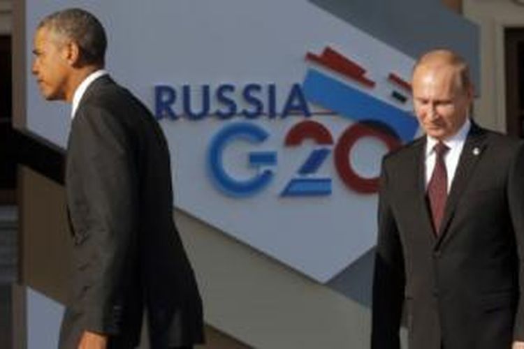 Presiden AS Barack Obama (kiri) dan Presiden Rusia Vladimir Putin saat KTT G-20 di St. Petersburg, Rusia. Separuh rakyat AS percaya AS-Rusia akan kembali terlibat 
