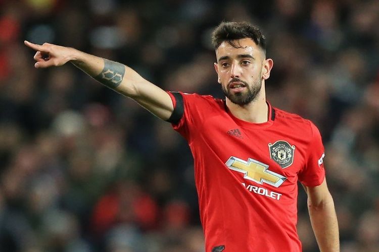 Pemain baru Manchester United, Bruno Fernandes, saat melakukan debutnya pada laga Liga Inggris kontra Wolverhampton Wanderers di Stadion Old Trafford, Manchester, pada Minggu (2/2/2020).