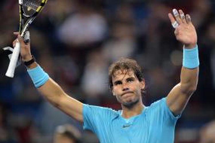 Petenis Spanyol, Rafael Nadal merayakan kemenangannya atas Alexandr Dolgopolov dari Ukraina, pada babak kedua Shanghai Masters, Rabu (9/10/2013). Nadal menang 6-3, 6-2.