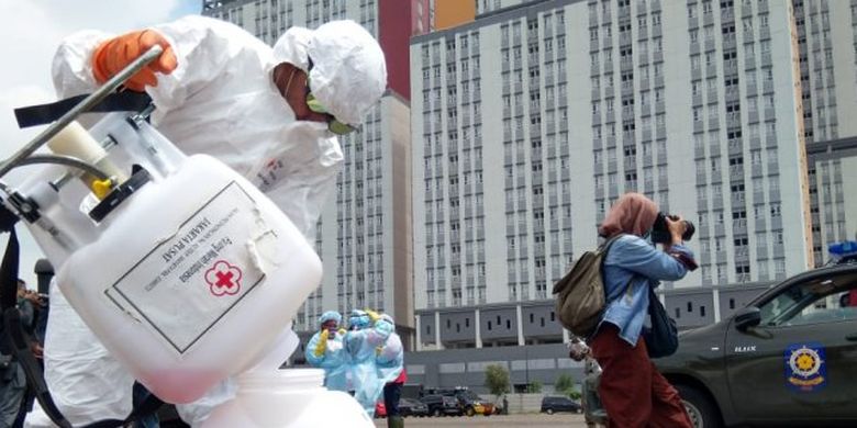 A member of the Indonesian Red Cross prepares to disinfect the Wisma Atlet Kemayoran emergency hospital for Covid-19 patients in Jakarta.