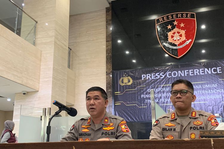 A spokesperson for the Indonesian Police Brigadier General Ahmad Ramadhan (left) speaks to journalists during a press conference. 