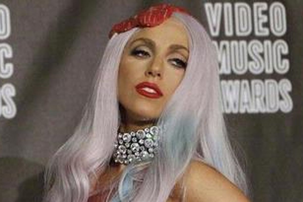 Lady Gaga, wearing an outfit made of meat, poses after winning eight awards at the 2010 MTV Video Music Awards in Los Angeles, in this September 12, 2010 file picture. Flamboyant pop singer Lady Gaga ousted U.S. media mogul Oprah Winfrey to top this 2011s Forbes celebrity power list released on May 18, 2011. Forbes rated the American singer-songwriter No. 1, estimating her earnings in the past 12 months as 90 million, but also noting her 32 million Facebook fans and 10 million Twitter followers