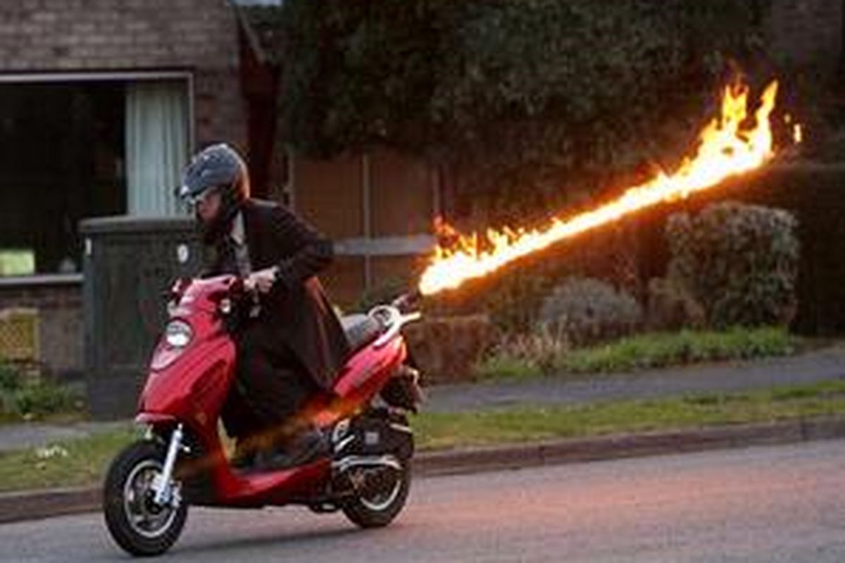 Hot wheels: Colin Furze has adapted his scooter so a gadget can fire out 15ft-long flames   