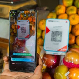 Ilustrasi pembayaran menggunakan QRIS. 