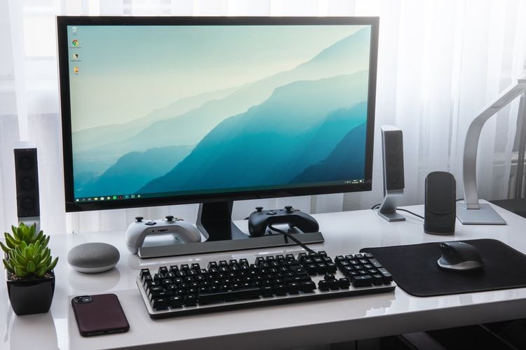 Ilustrasi komponen komputer, yang terdiri dari perangkat input, output, processing, dan storage.