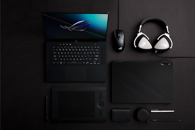 Ilustrasi laptop Asus ROG Zephyrus M16 beserta perangkat pereipheral pendukung.