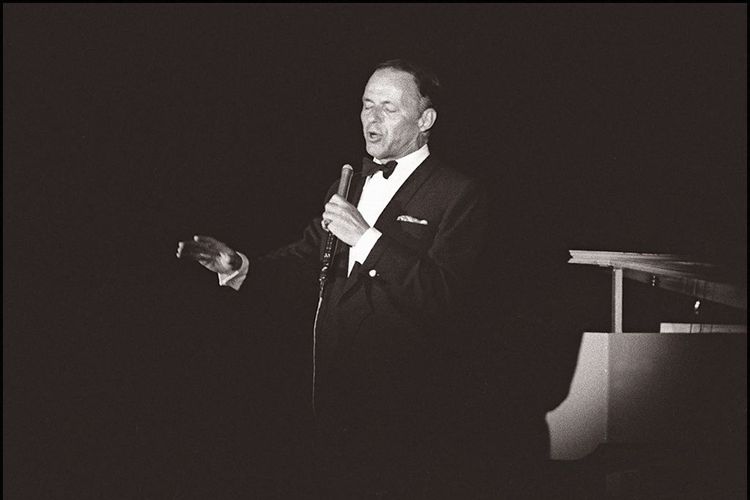 Legendary US singer Frank Sinatra in a picture taken 06 June 1962 in Paris performs on stage of the Lido Theater. (Photo by AFP)